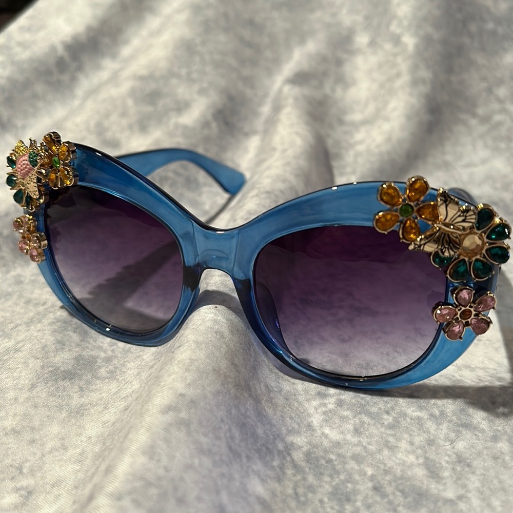 New blue sunglasses. Bedazzled with butterflies, bees and flowers.